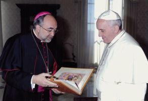 Pope Francis I with his Book of Testaments